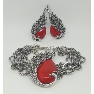 Silver tone peacock set with red howlite stone